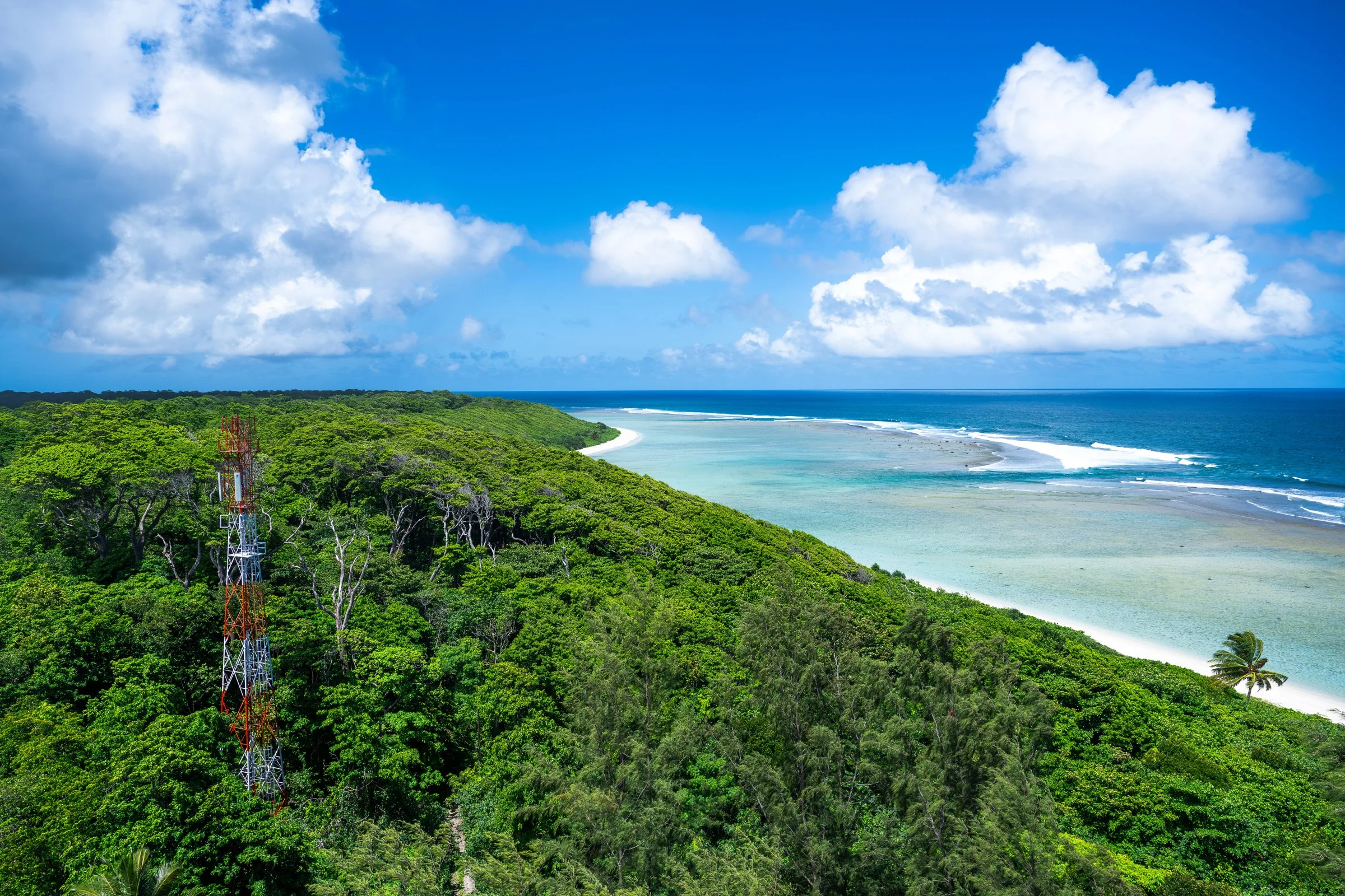 Forested coastline and pale shallow water on Little Andaman, supplied by Andamanica