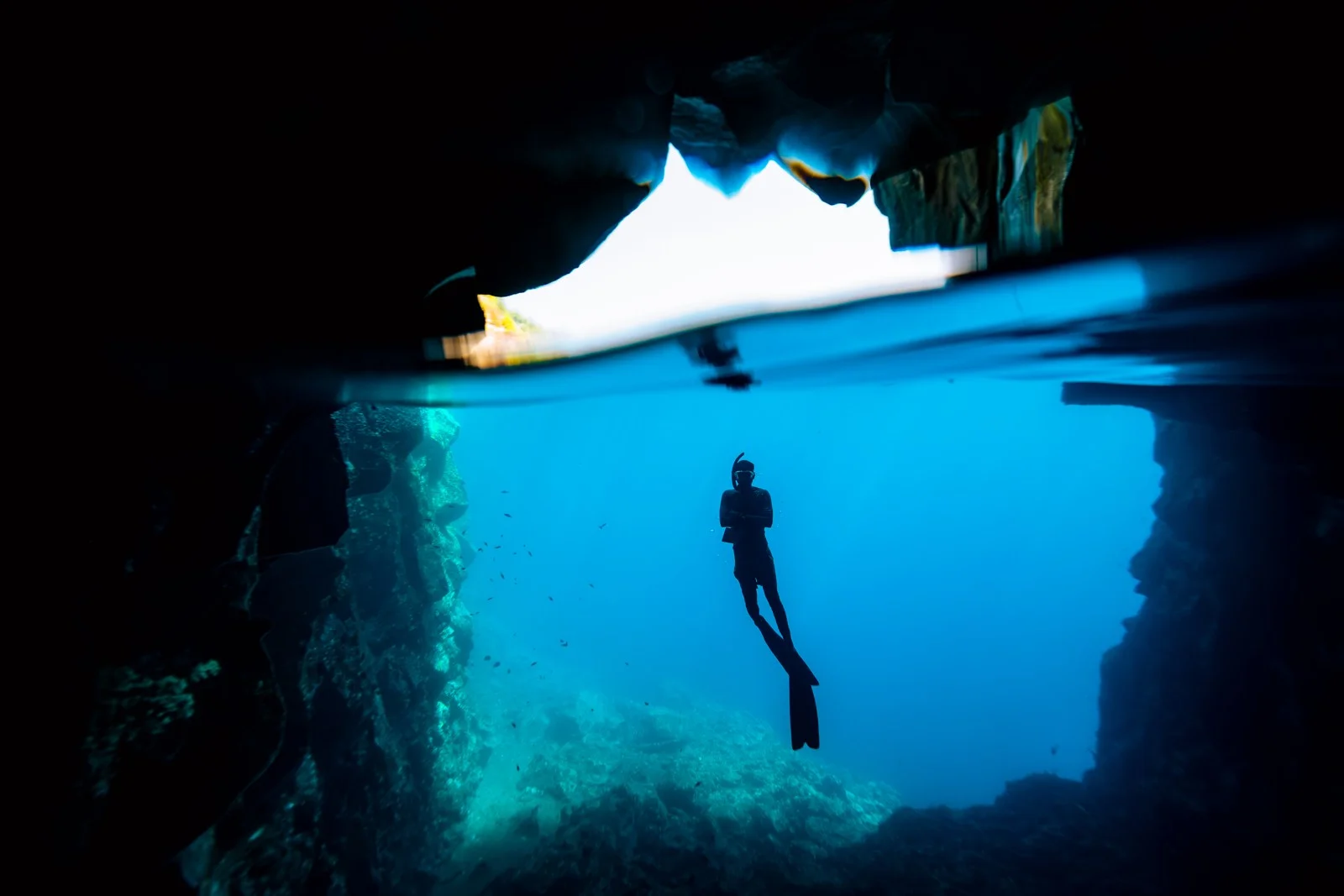 Freediver below the water surface, supplied by Andamanica
